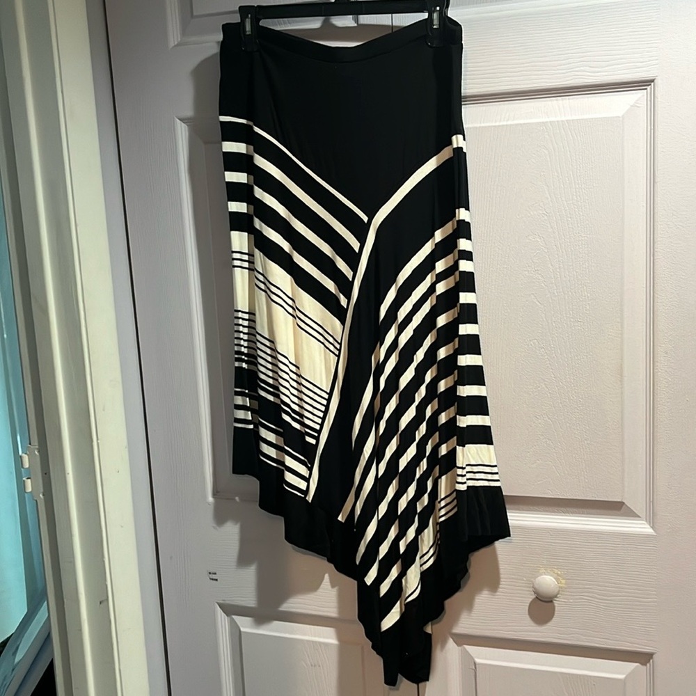 Spense black and beige with asymmetrical skirt.
